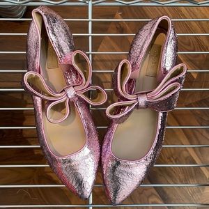 Pair of flats, size 10, with pink bows.